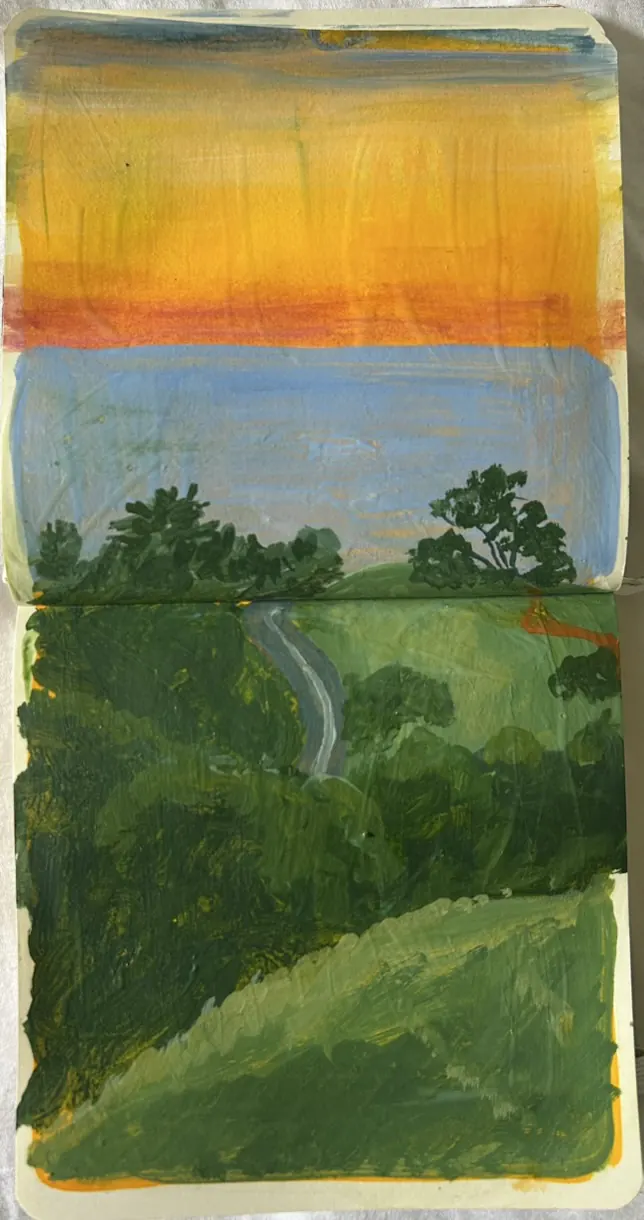 Mount Tamp, spread 2 of 3: gouache sketchbook page of green hills with a winding grey path under an orange and yellow sky.